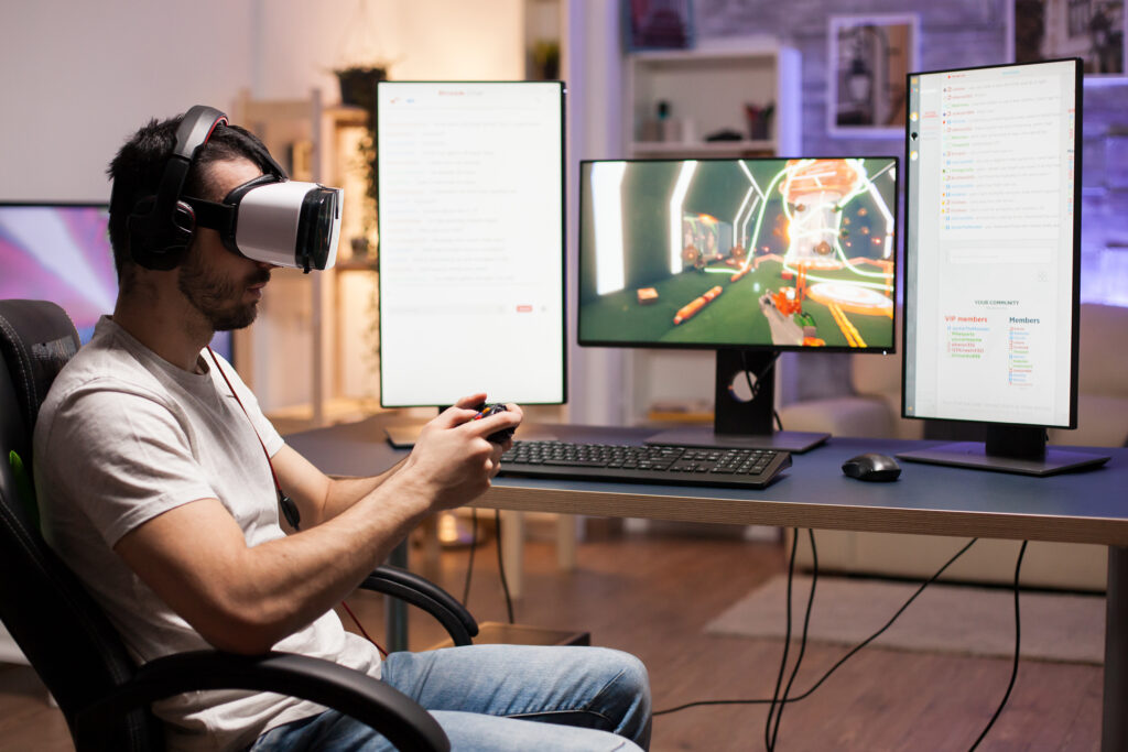 Professional Gamer Wearing Virtual Reality Headset While Playing Shooter Games Stream 1024x683